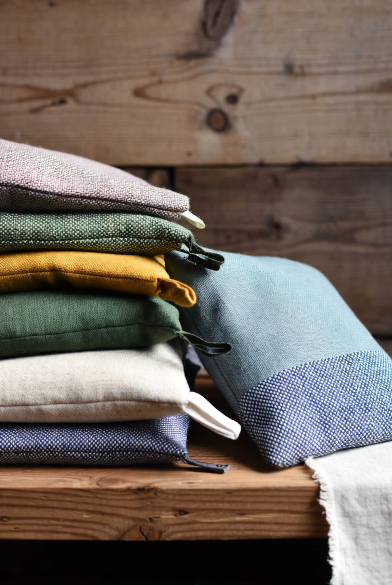 Set of travel fabric pouches on a marble table